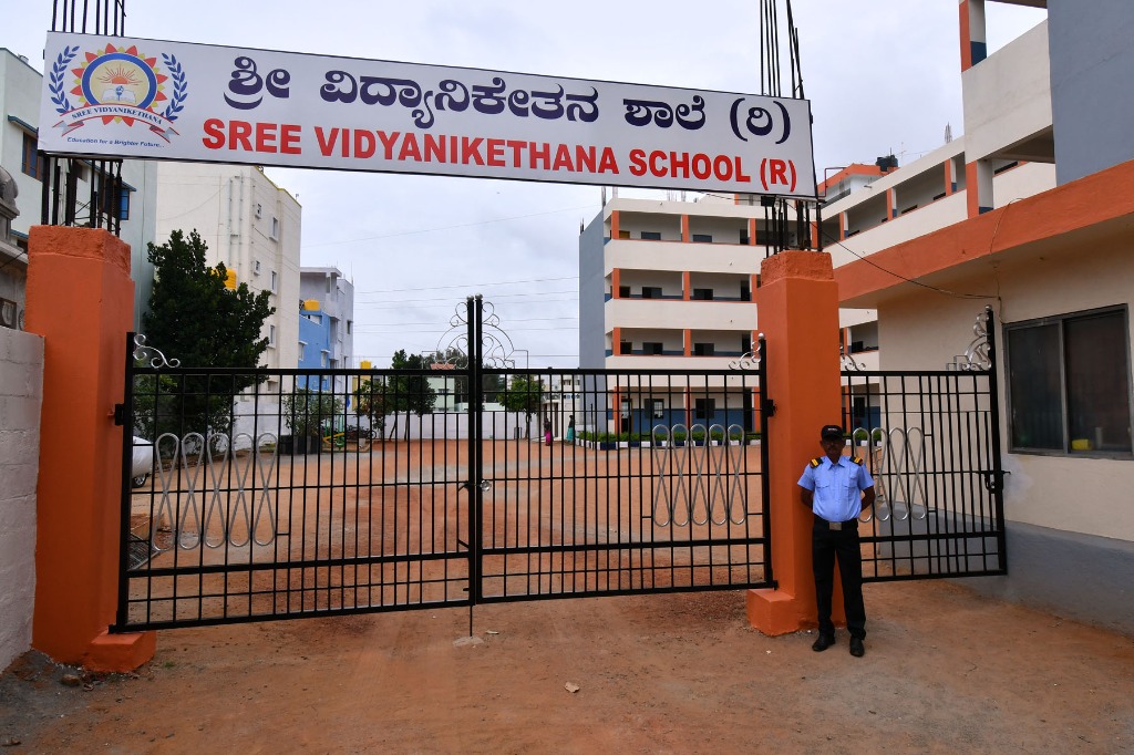 Sree Vidyanikethana school main entrance gate with security guard